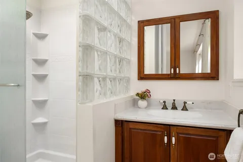 a bathroom with a sink and a mirror