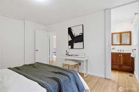 a bedroom with a bed and a fireplace