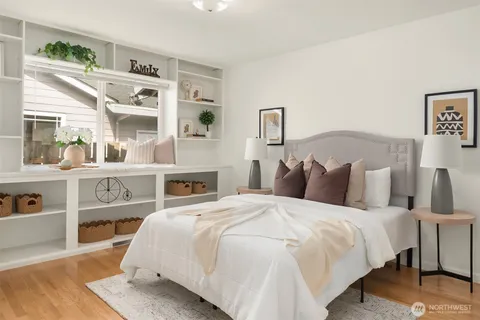 a bed room with a bed and a night stand