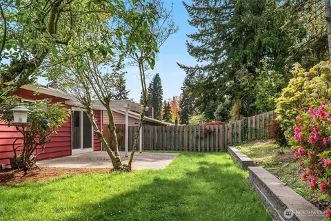 a garden with wooden fence