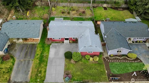 an aerial view of multiple houses with yard