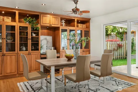 a view of a dining room with furniture window and outside view