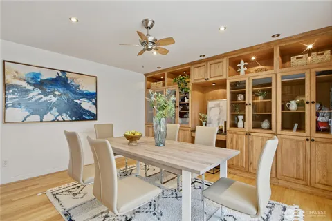 a view of a dining room with furniture window and wooden floor