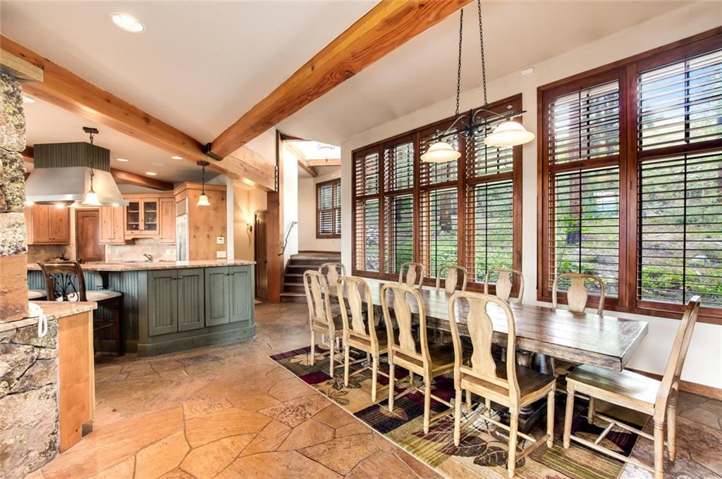 1050 4 O Clock Road Breckenridge, CO 80424 - Photo 13 of 35 a dining room with furniture and large windows