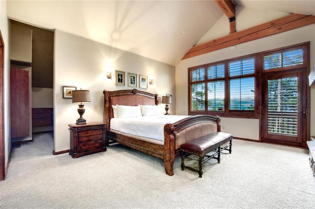 1050 4 O Clock Road Breckenridge, CO 80424 - Photo 16 of 35 a bedroom with a bed and a cabinets