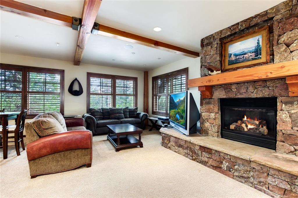 1050 4 O Clock Road Breckenridge, CO 80424 - Photo 20 of 35 a living room with furniture and a fireplace