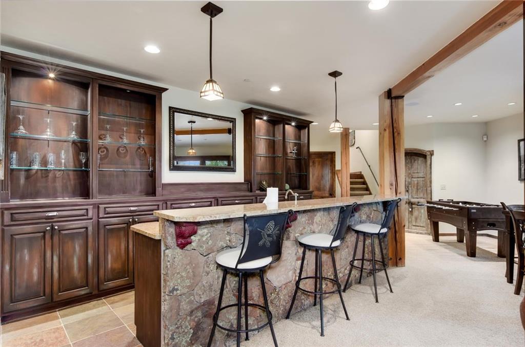 1050 4 O Clock Road Breckenridge, CO 80424 - Photo 21 of 35 a kitchen with lots of counter space and windows