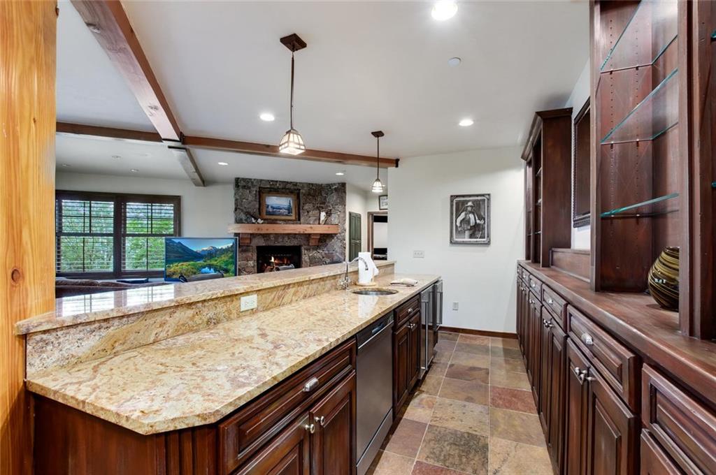 1050 4 O Clock Road Breckenridge, CO 80424 - Photo 22 of 35 a large kitchen with kitchen island a large counter space