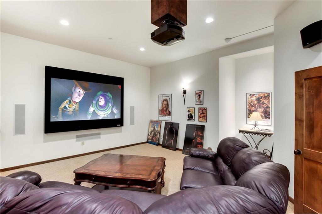 1050 4 O Clock Road Breckenridge, CO 80424 - Photo 23 of 35 a living room with furniture and a flat screen tv