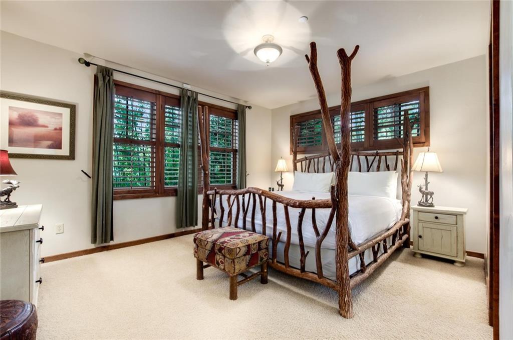 1050 4 O Clock Road Breckenridge, CO 80424 - Photo 25 of 35 a bedroom with a bed and a window