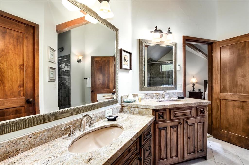 1050 4 O Clock Road Breckenridge, CO 80424 - Photo 29 of 35 a bathroom with a sink vanity and a mirror