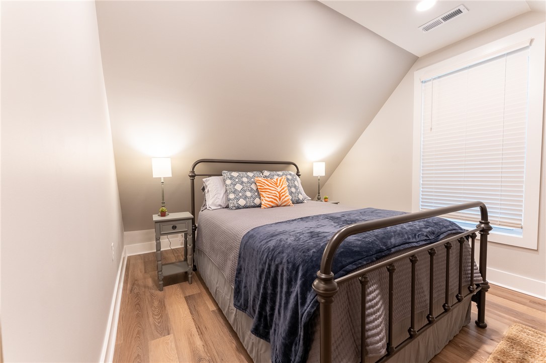 103 Riggs Drive Clemson, SC 29631 - Photo 42 of 50 Sloped ceilings and a generous window create a charming, naturally lit sleeping space.