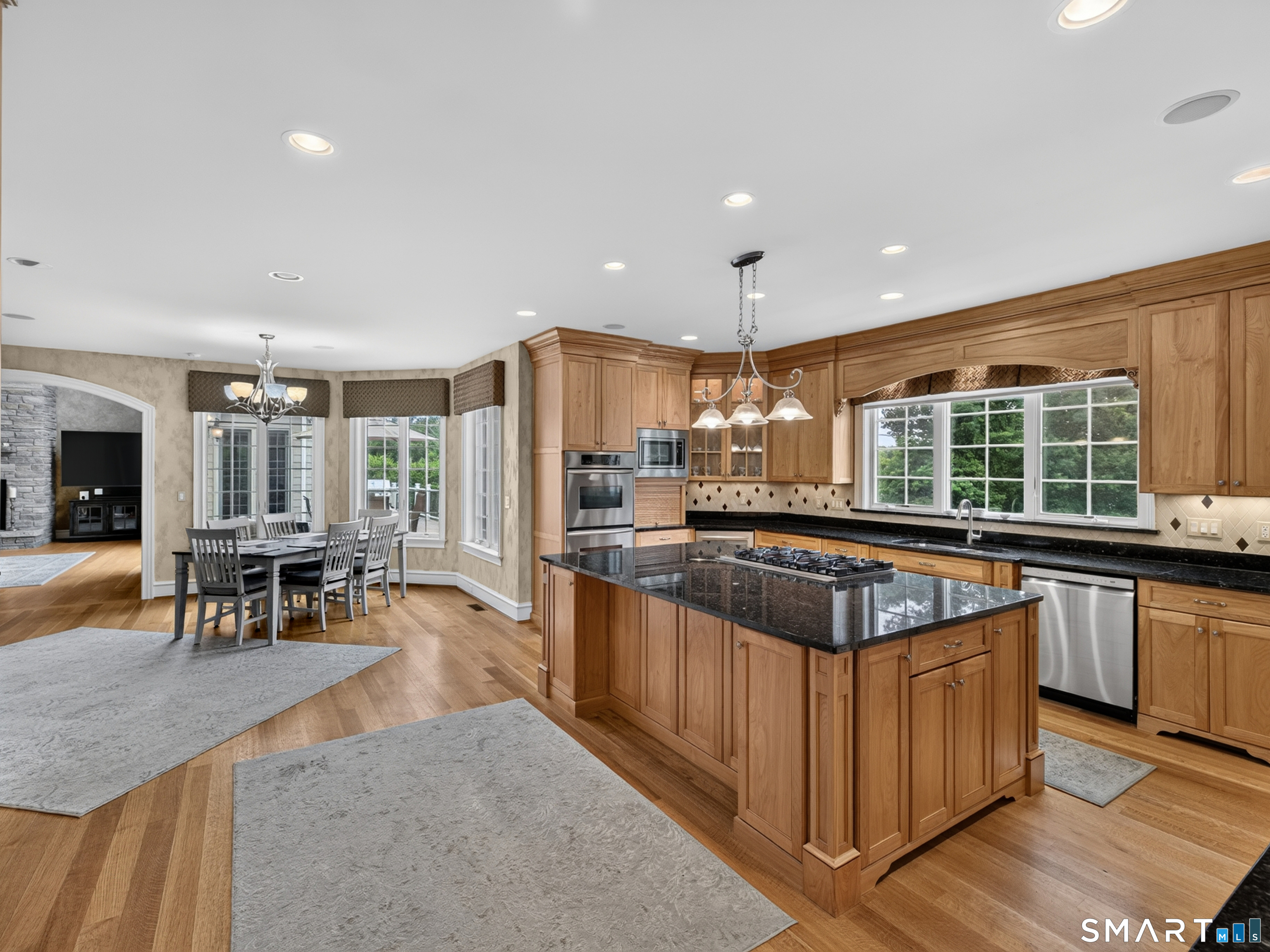 55 Hunters Ridge Rocky Hill, CT 06067 - Photo 11 of 40 a kitchen with stainless steel appliances granite countertop a stove and a sink