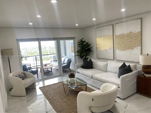 a living room with furniture and a large window