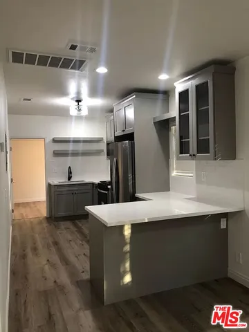 a view of a kitchen with a sink