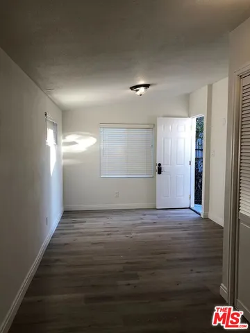 a view of wooden floor and staircase in a room