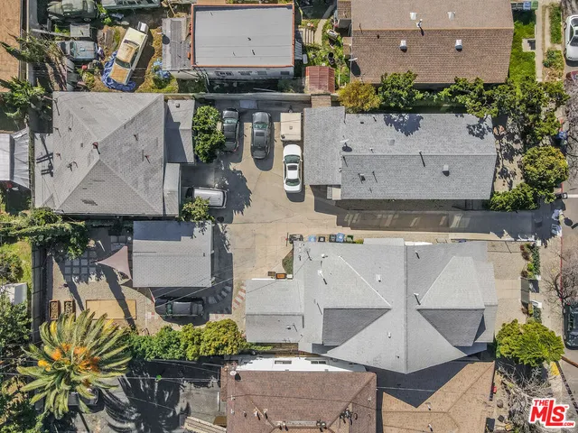 an aerial view of multiple houses with outdoor space