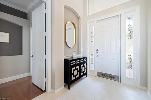 a view of an entryway with wooden floor