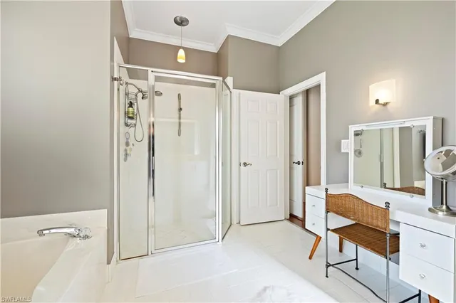 a spacious bathroom with a shower and a sink