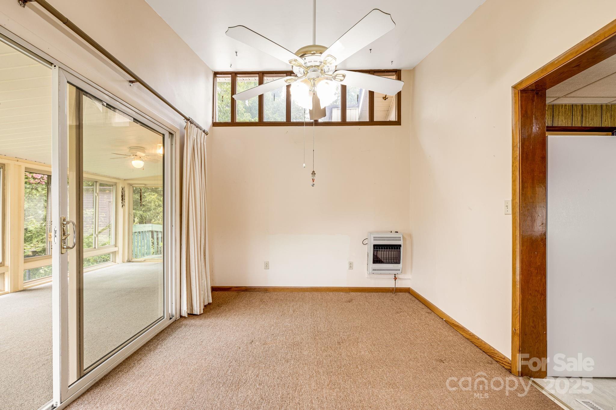 141 Macedonia Road Asheville, NC 28804 - Photo 11 of 33 an empty room and chandelier fan