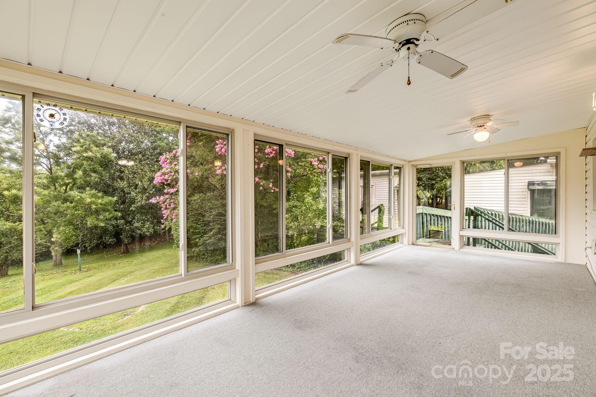 141 Macedonia Road Asheville, NC 28804 - Photo 13 of 33 a view of an empty room with windows