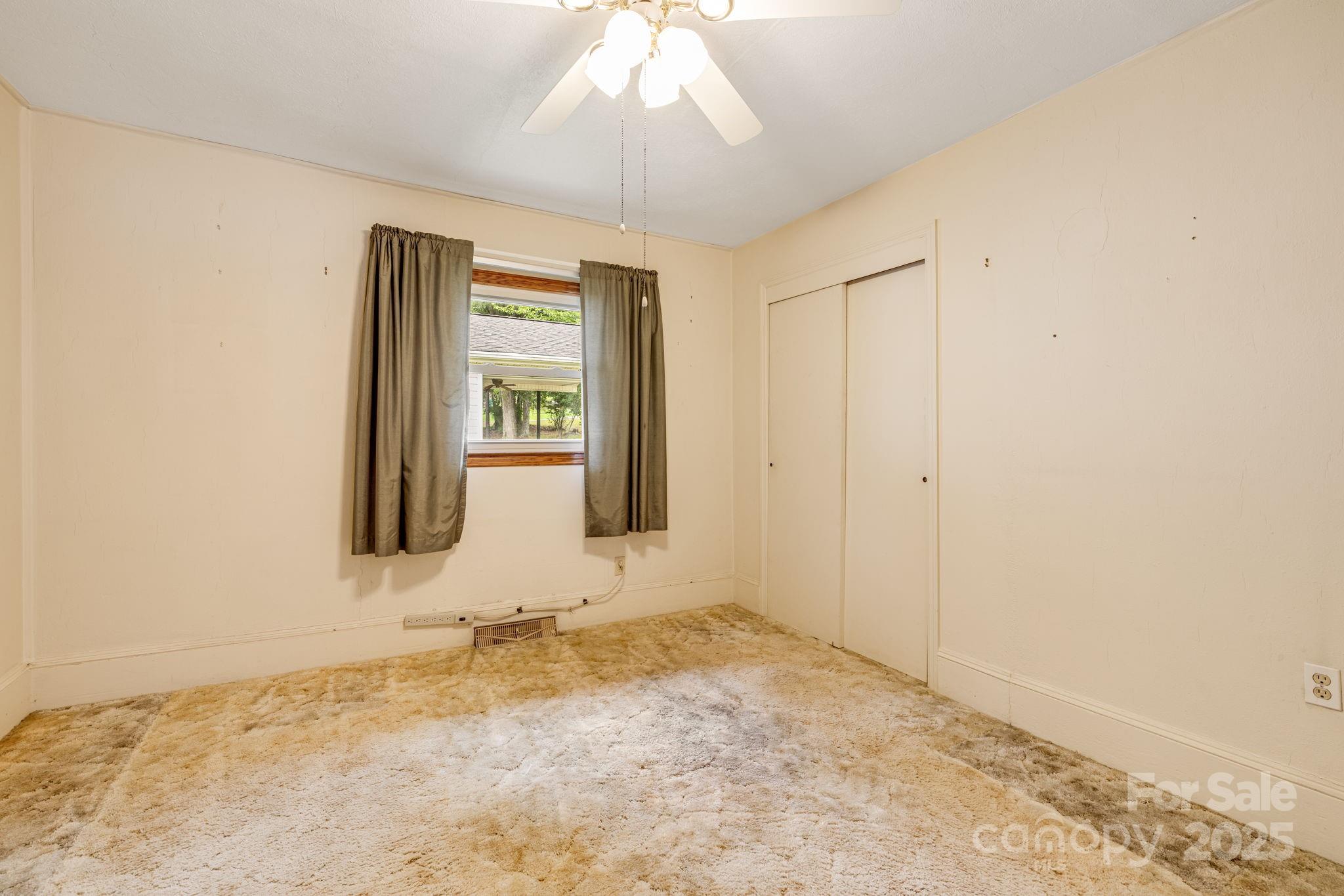 141 Macedonia Road Asheville, NC 28804 - Photo 16 of 33 wooden floor and window in an empty room