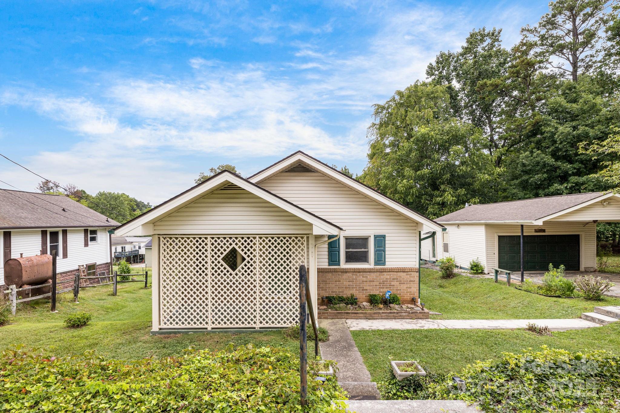 141 Macedonia Road Asheville, NC 28804 - Photo 2 of 33 a front view of a house with a yard