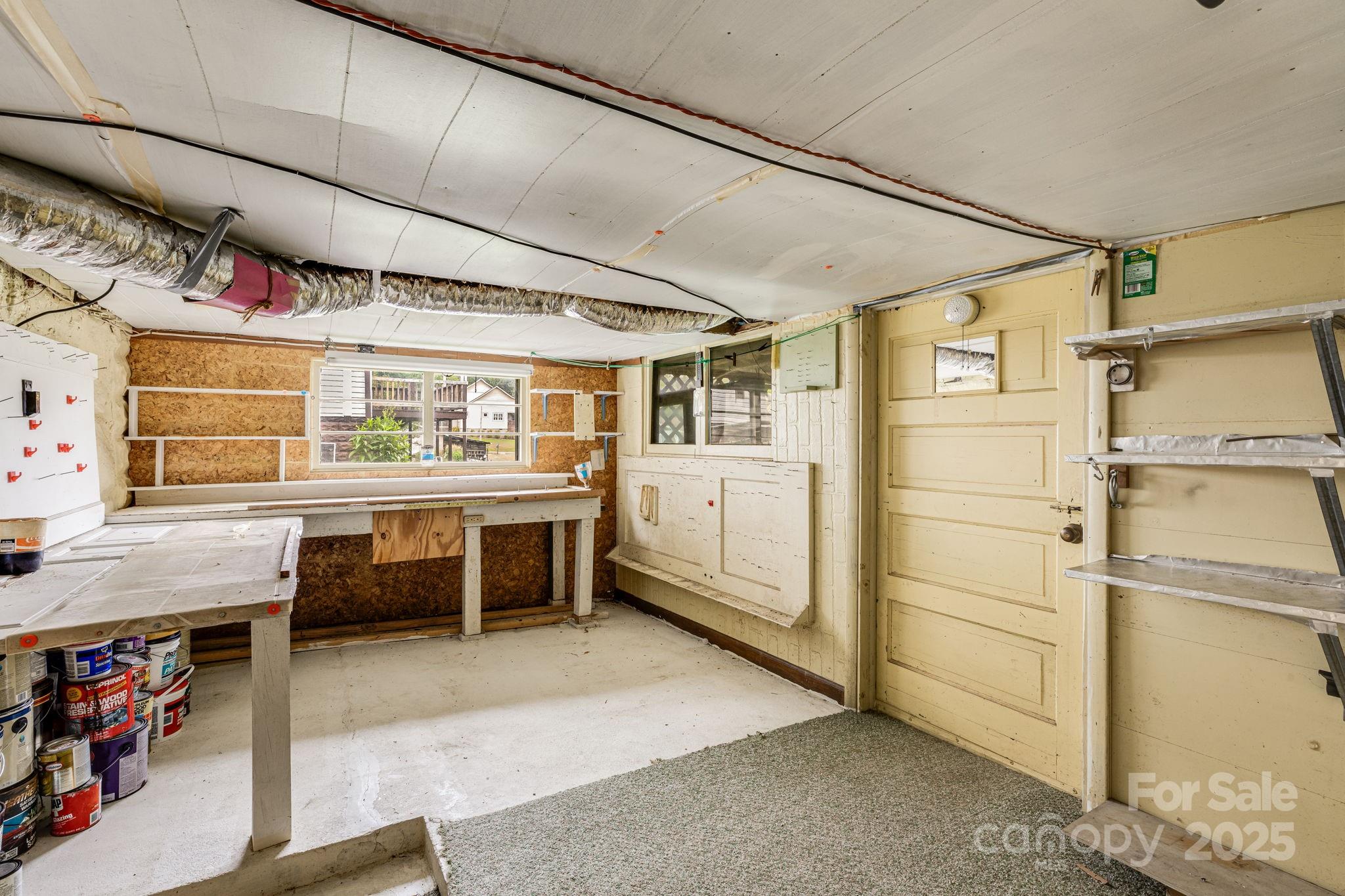 141 Macedonia Road Asheville, NC 28804 - Photo 21 of 33 a utility room with cabinets dryer and washer