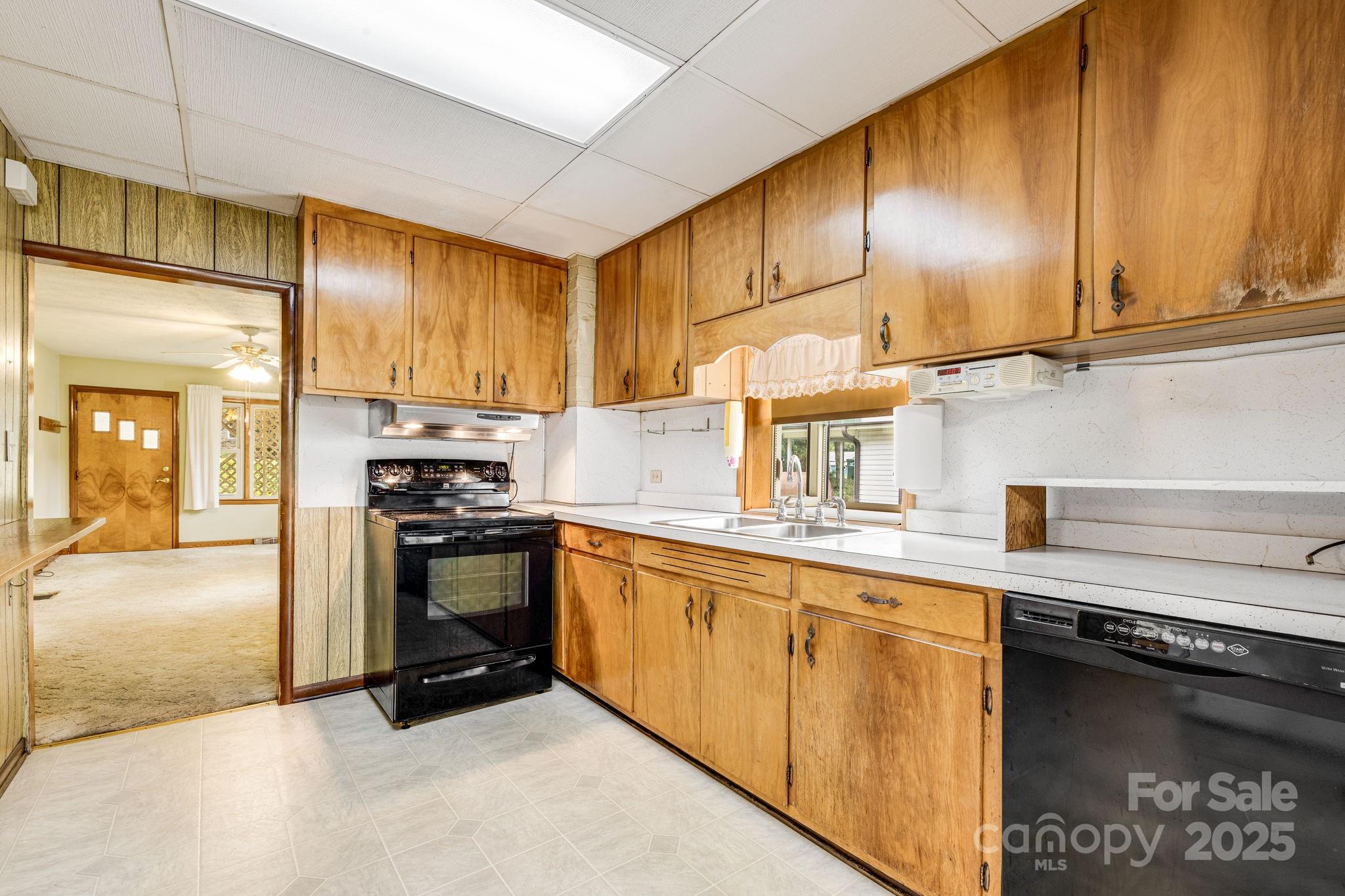 141 Macedonia Road Asheville, NC 28804 - Photo 9 of 33 a kitchen with stainless steel appliances granite countertop a sink a stove and cabinets