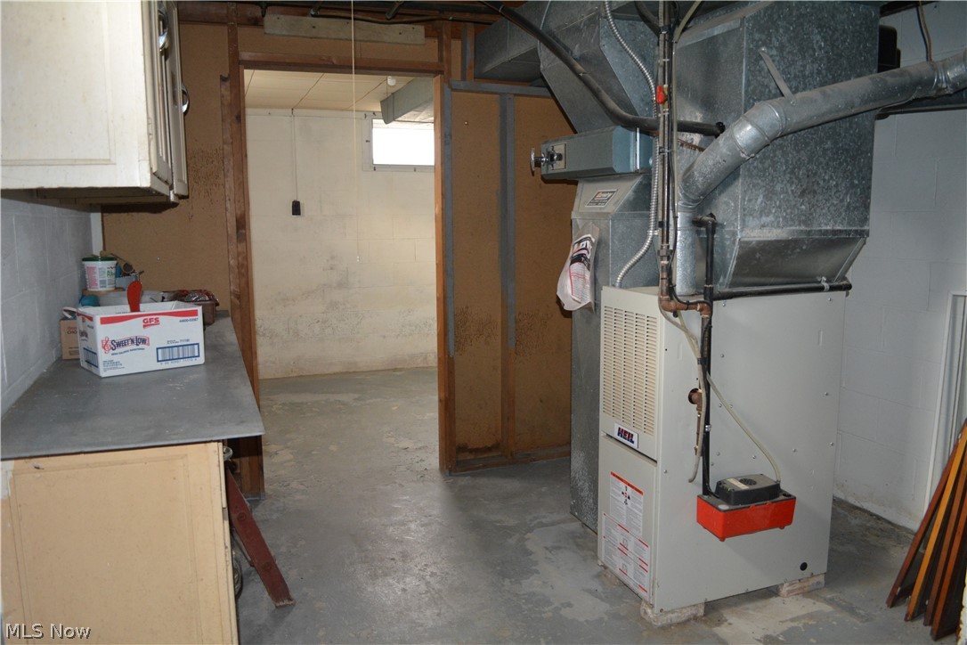 5674 Myers Road New Franklin, OH 44319 - Photo 23 of 26 Utility area leading to another storage room.
