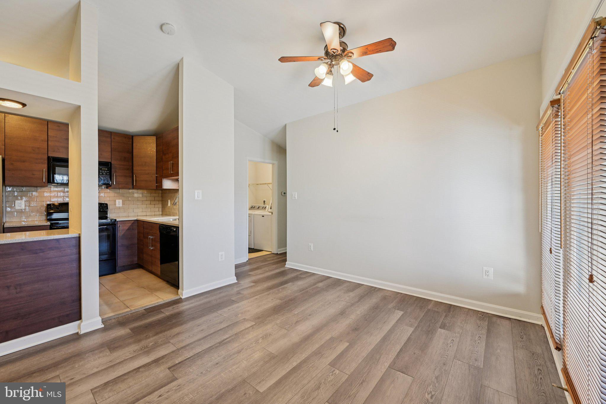 2104 Whitehall Road, Unit 2B Frederick, MD 21702 - Photo 11 of 37 wooden floor in an empty room with a kitchen