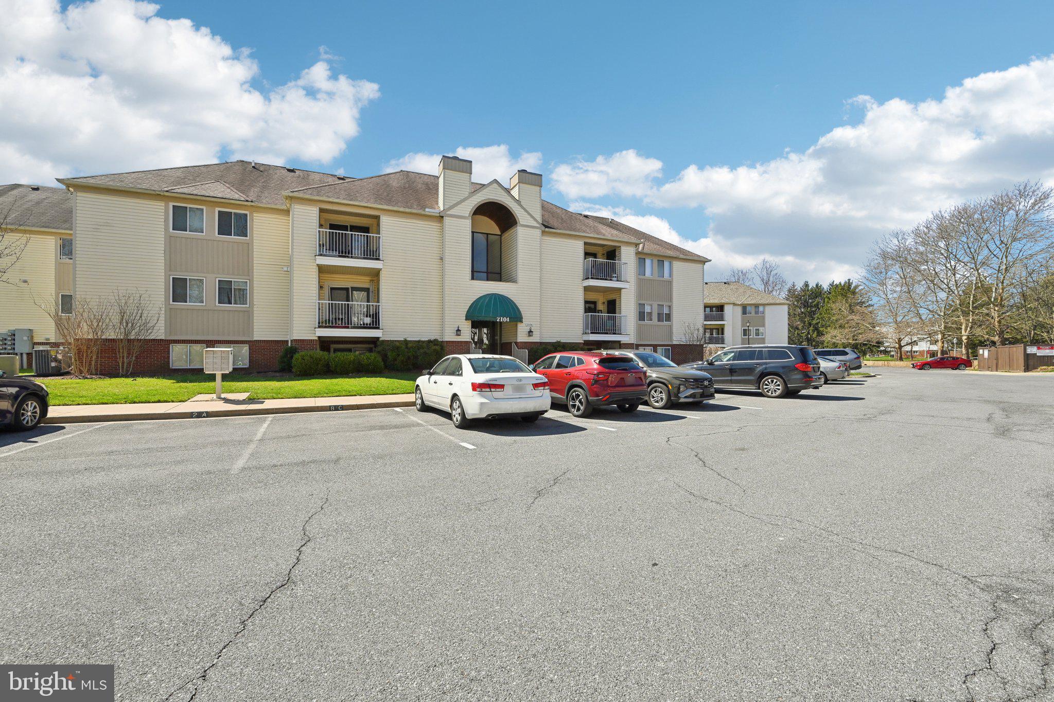 2104 Whitehall Road, Unit 2B Frederick, MD 21702 - Photo 2 of 37 a view of a cars parked in front of a building