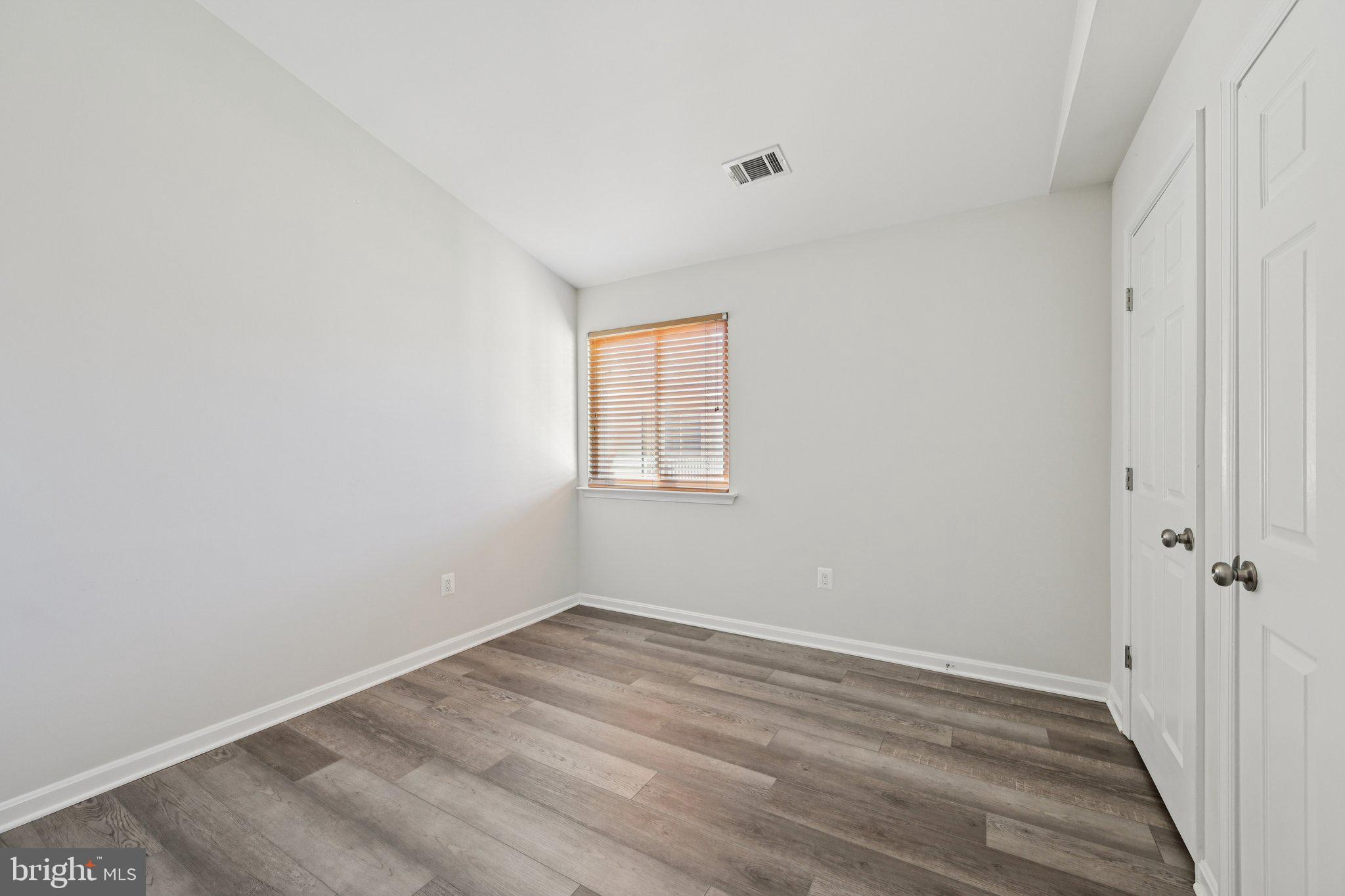 2104 Whitehall Road, Unit 2B Frederick, MD 21702 - Photo 26 of 37 a view of a room that has wooden floor and window