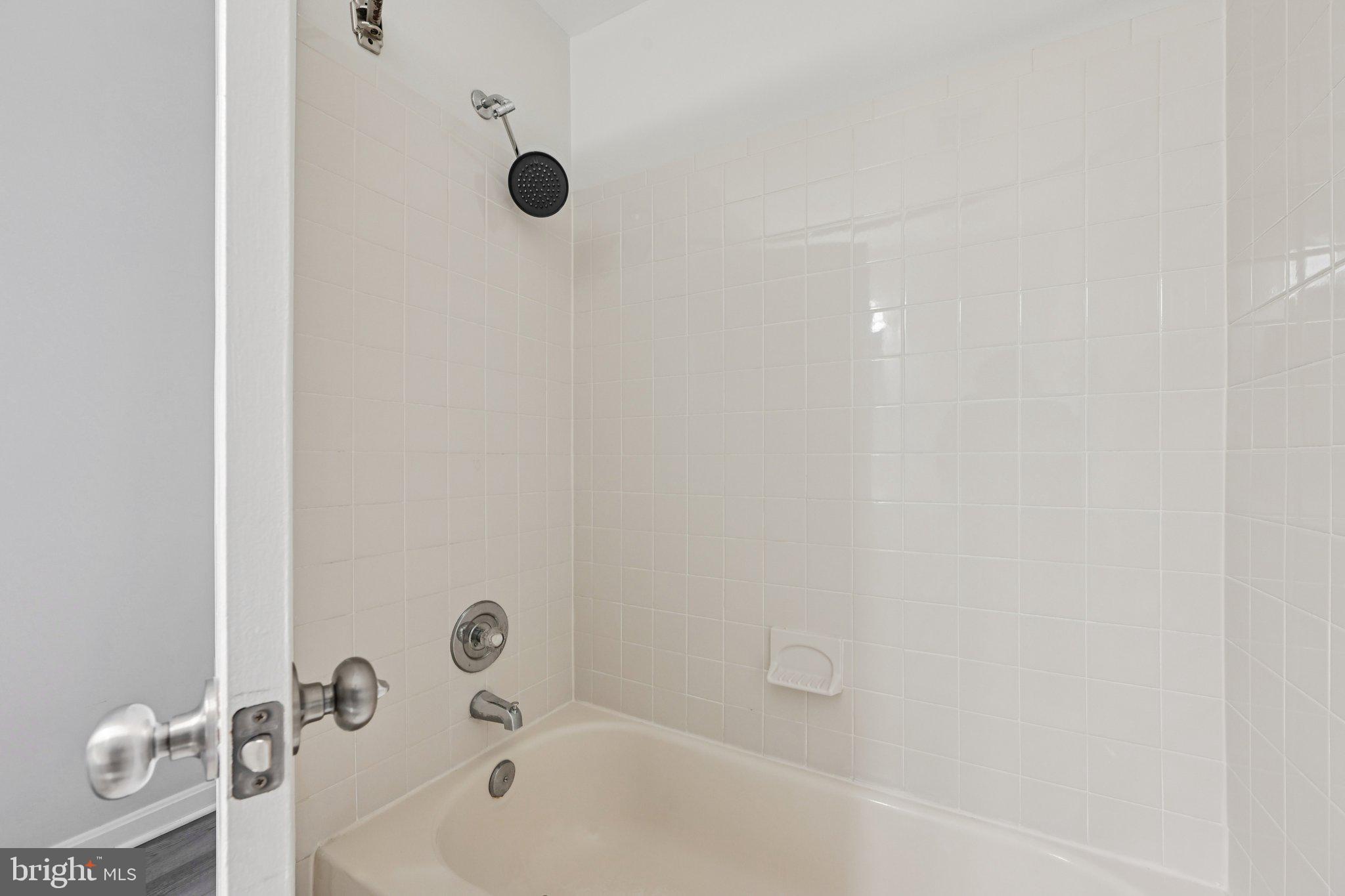 2104 Whitehall Road, Unit 2B Frederick, MD 21702 - Photo 30 of 37 a bathroom with a bathtub