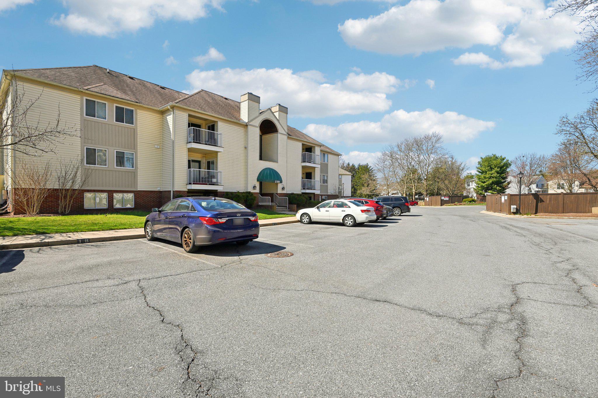 2104 Whitehall Road, Unit 2B Frederick, MD 21702 - Photo 35 of 37 a car parked in front of a white building