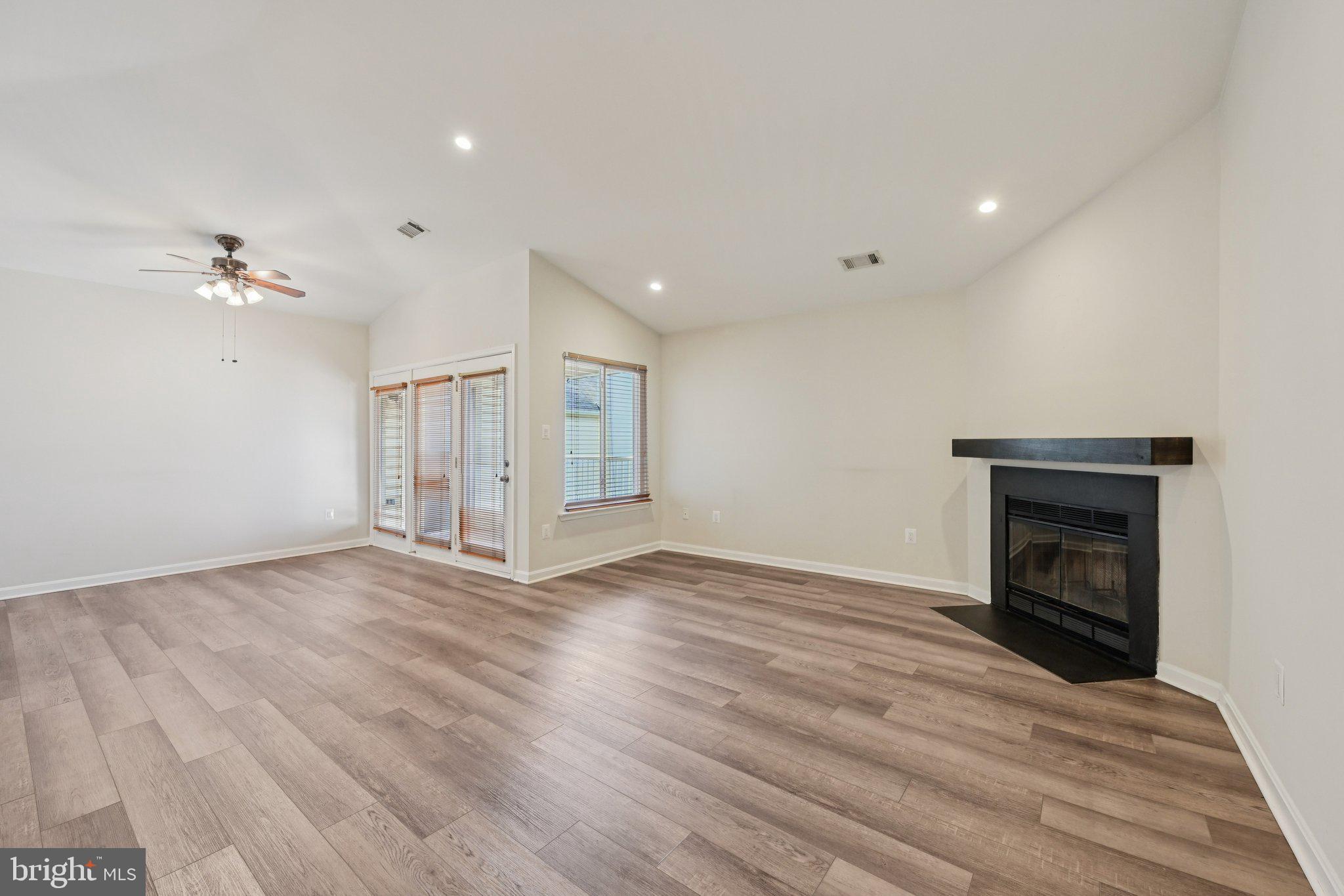 2104 Whitehall Road, Unit 2B Frederick, MD 21702 - Photo 5 of 37 a view of empty room with wooden floor and fan