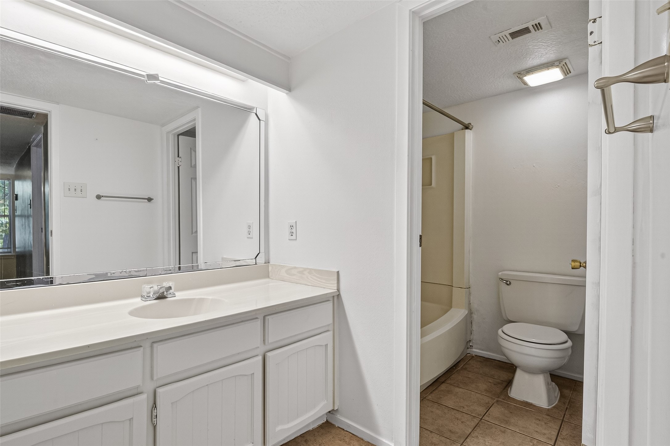 1106 East Red Cedar Circle Spring, TX 77380 - Photo 28 of 43 a bathroom with a sink a toilet and shower