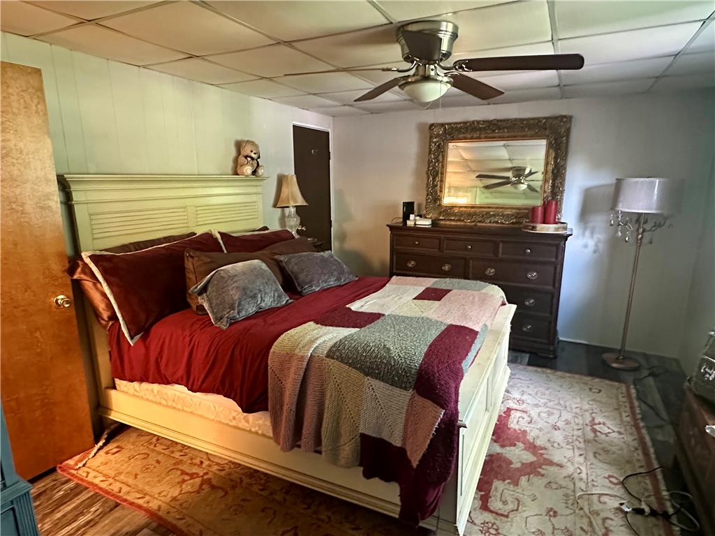 381 Red Oak Lane Bath, PA 18014 - Photo 14 of 27 Rest peacefully in this primary bedroom featuring a ceiling fan and a wood floor with an area rug.