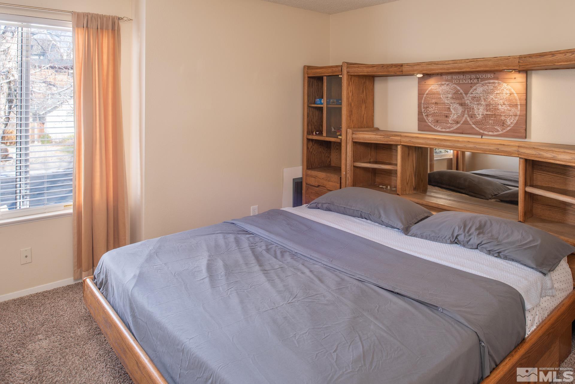3836 Bexley Square Reno, NV 89503 - Photo 17 of 38 a bedroom with a large bed and a window