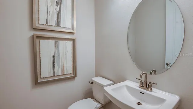 a bedroom with a large bed and a large window