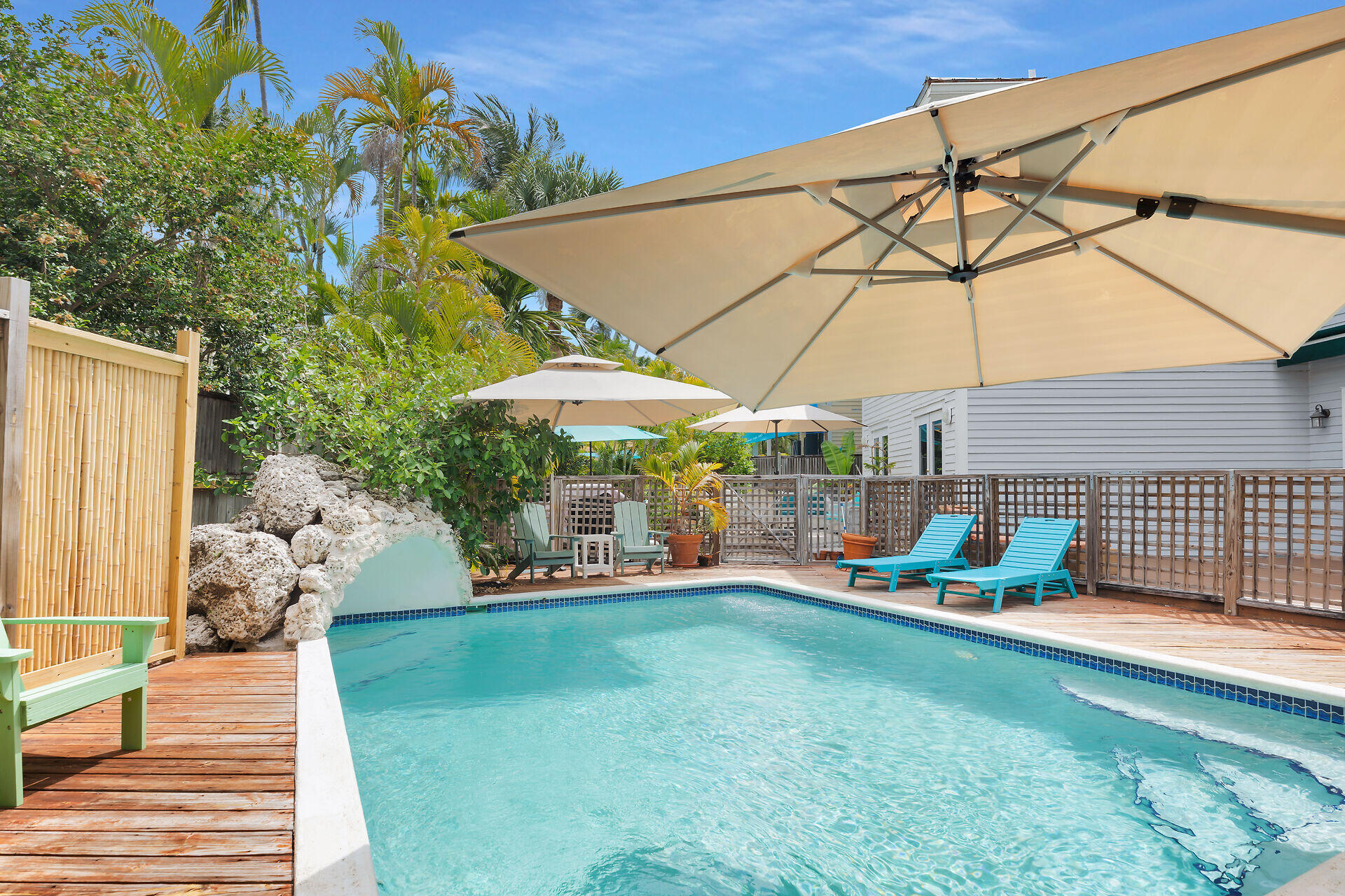1001 United Street, Unit B Key West, FL 33040 - Photo 17 of 48 a view of a backyard with a patio and wooden fence