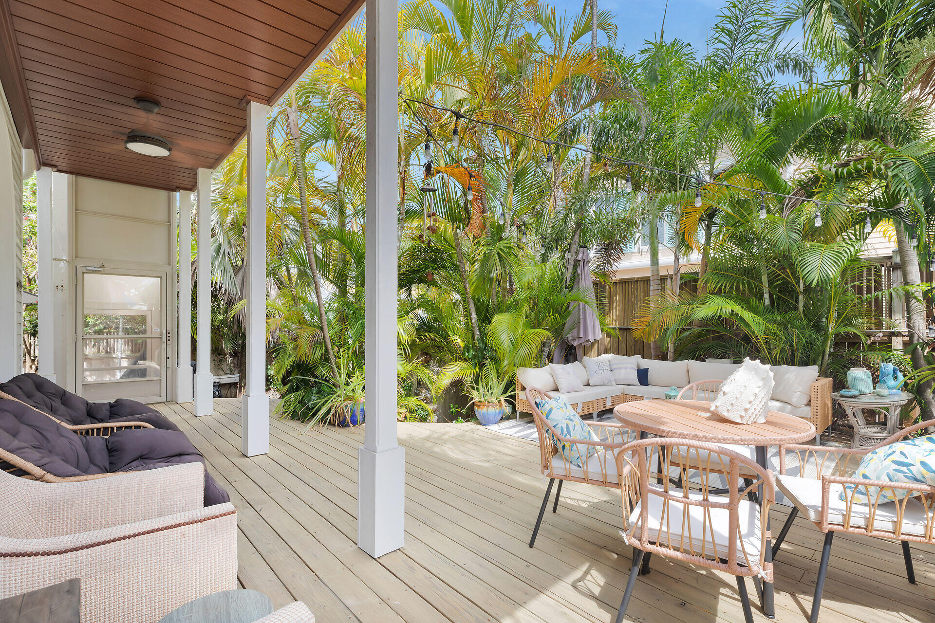 1001 United Street, Unit B Key West, FL 33040 - Photo 18 of 48 a view of a patio with a table and chairs next to a yard