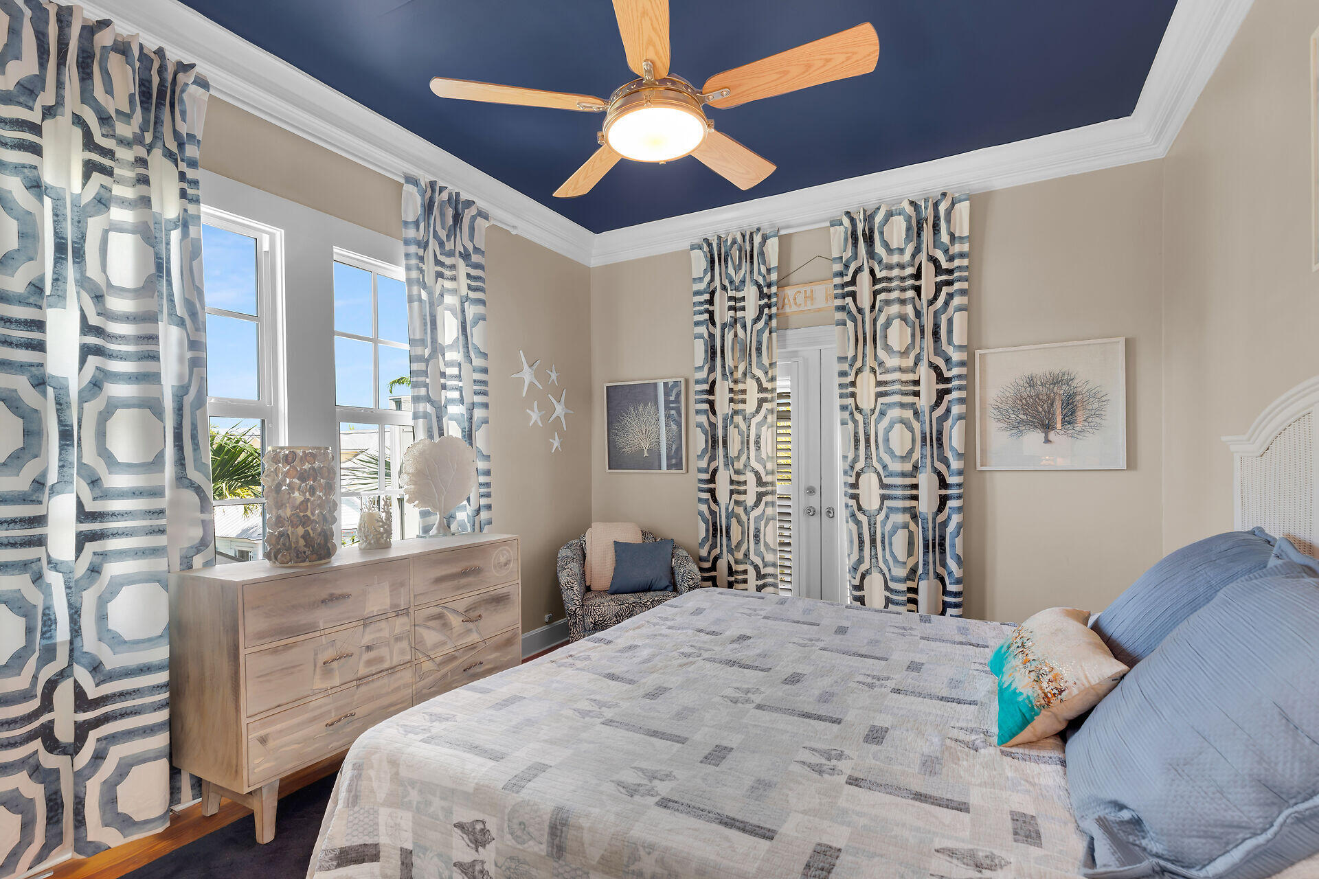 1001 United Street, Unit B Key West, FL 33040 - Photo 34 of 48 a bedroom with a bed and a chandelier