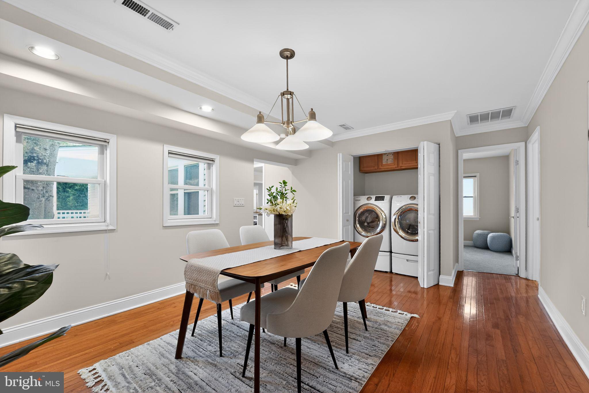 23711 Slidell Road Clarksburg, MD 20871 - Photo 11 of 31 a view of a dining room with furniture window and wooden floor