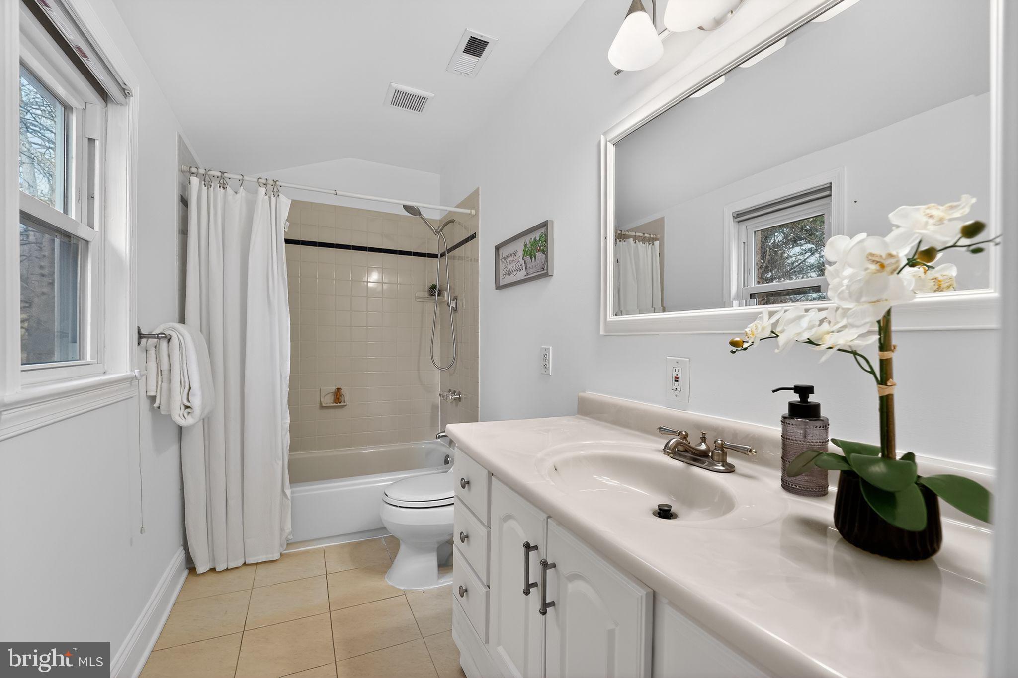 23711 Slidell Road Clarksburg, MD 20871 - Photo 22 of 31 a bathroom with a sink double vanity and a toilet