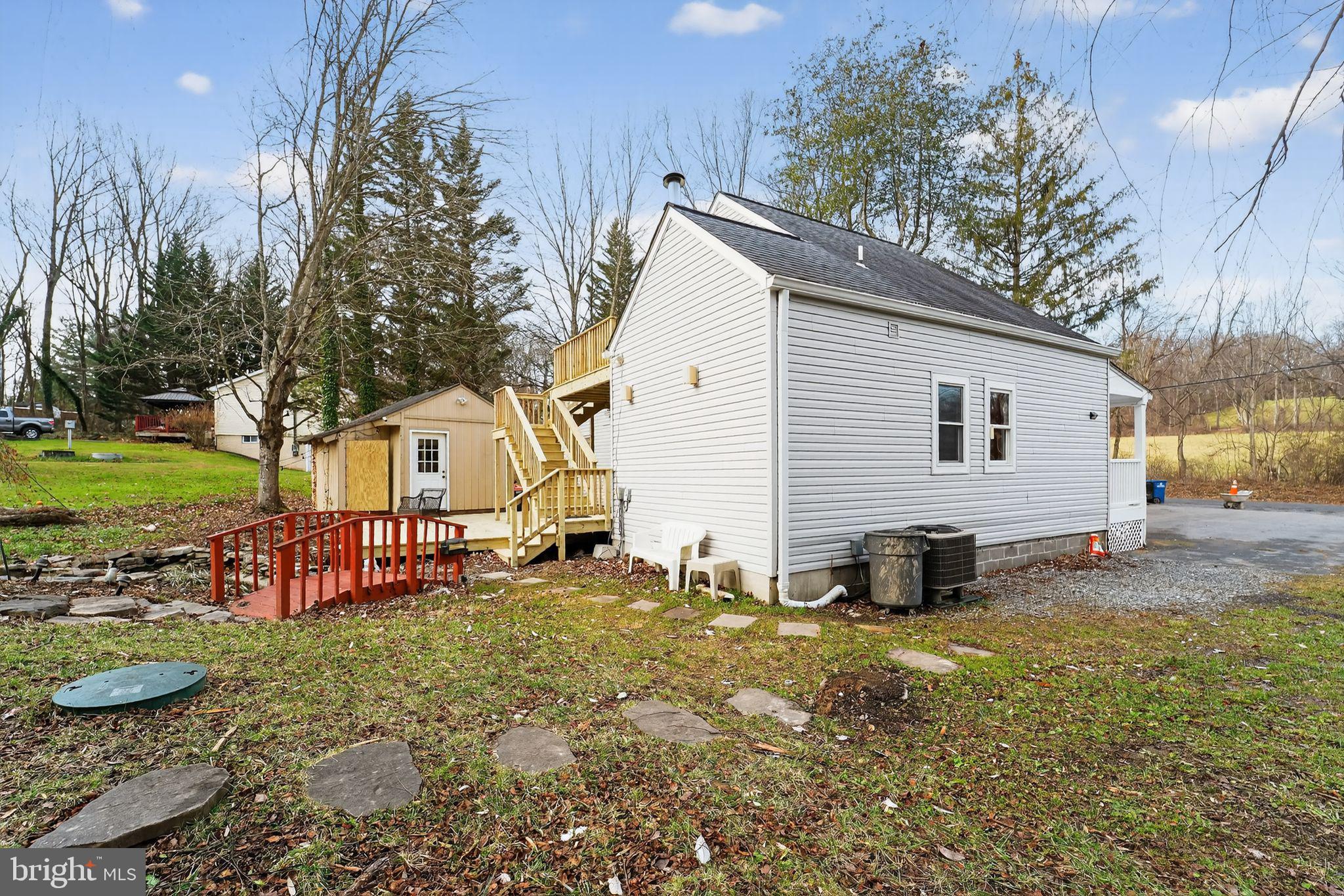 23711 Slidell Road Clarksburg, MD 20871 - Photo 30 of 31 a white house that has a tree in front of it