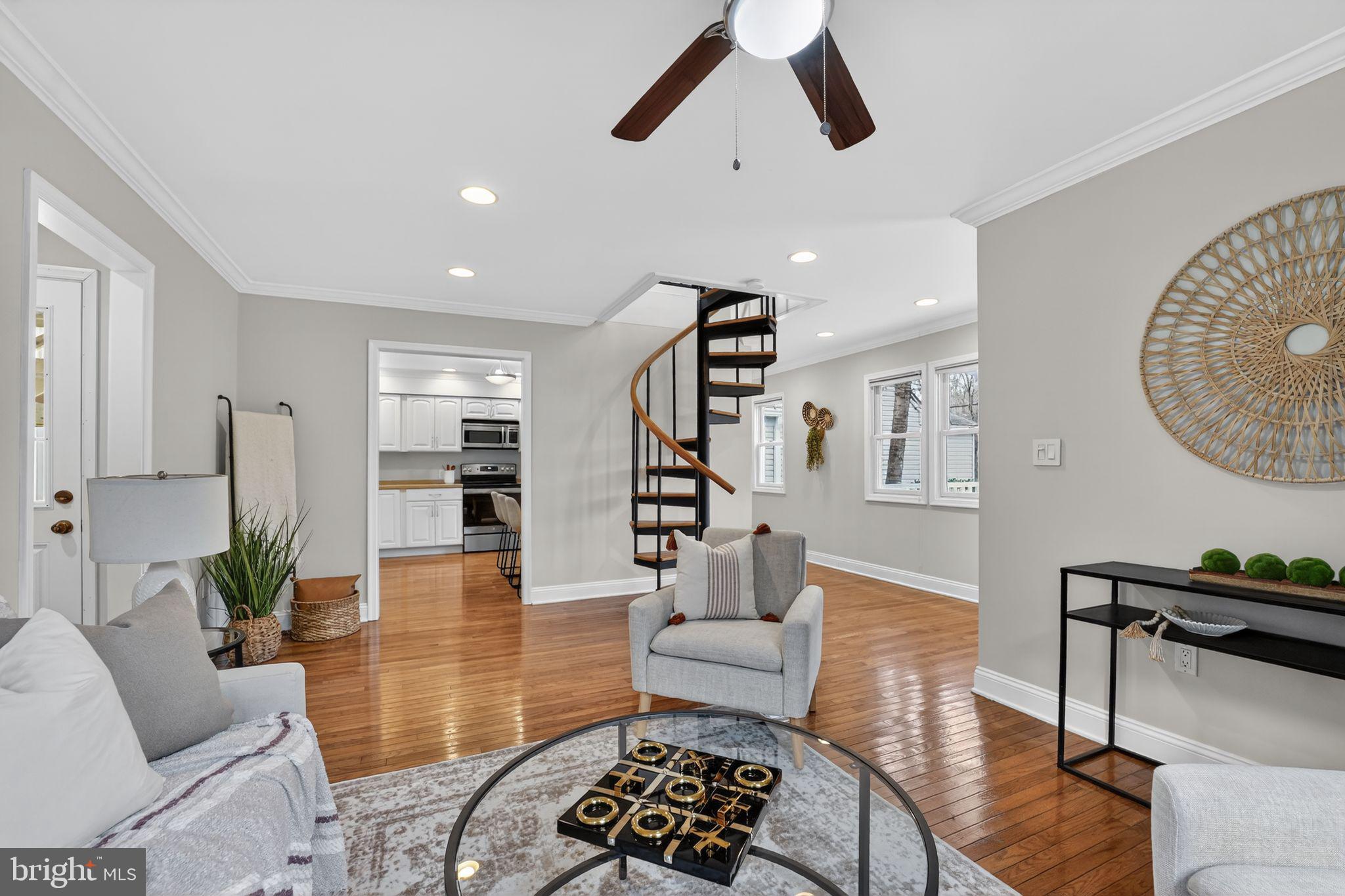 23711 Slidell Road Clarksburg, MD 20871 - Photo 3 of 31 a living room with furniture and wooden floor