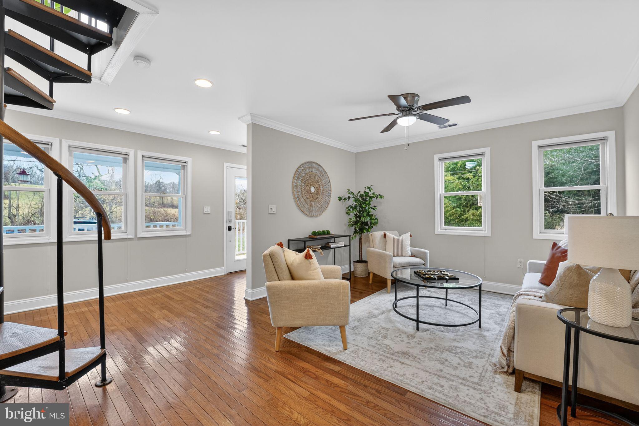 23711 Slidell Road Clarksburg, MD 20871 - Photo 4 of 31 a living room with furniture a window and a chandelier