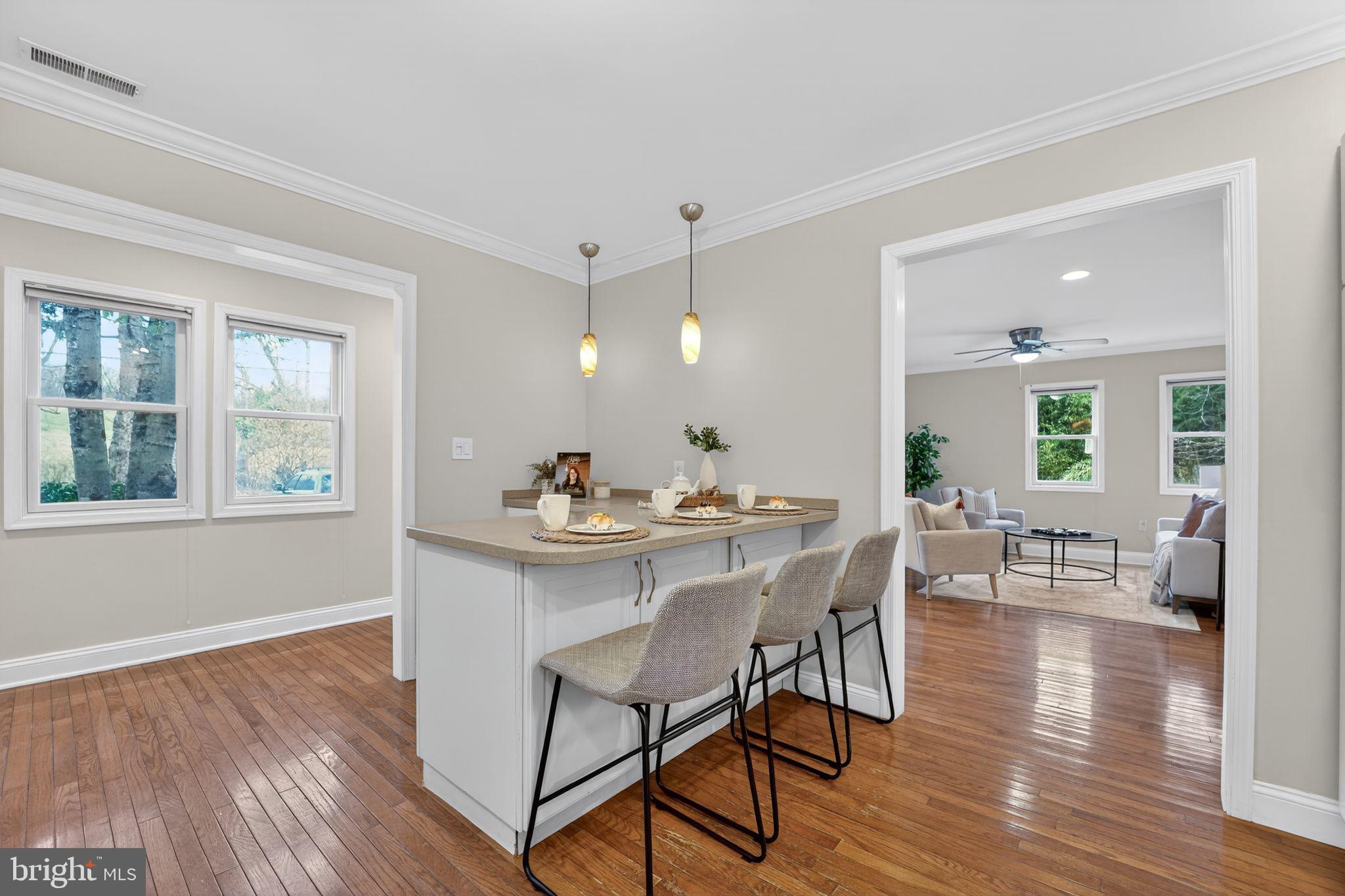 23711 Slidell Road Clarksburg, MD 20871 - Photo 7 of 31 a view of a dining room with furniture and wooden floor