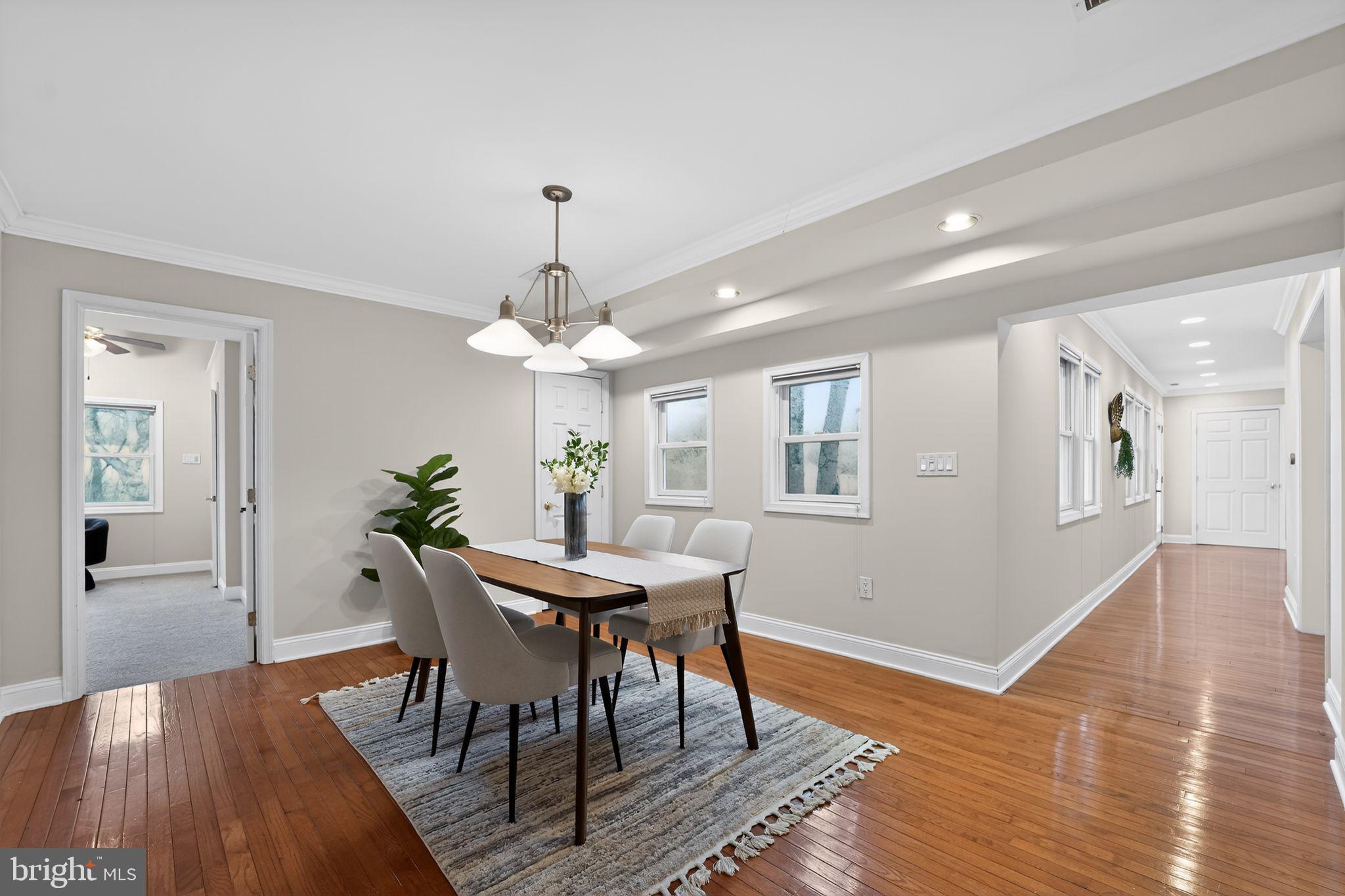 23711 Slidell Road Clarksburg, MD 20871 - Photo 10 of 31 a view of a dining room with furniture wooden floor and chandelier